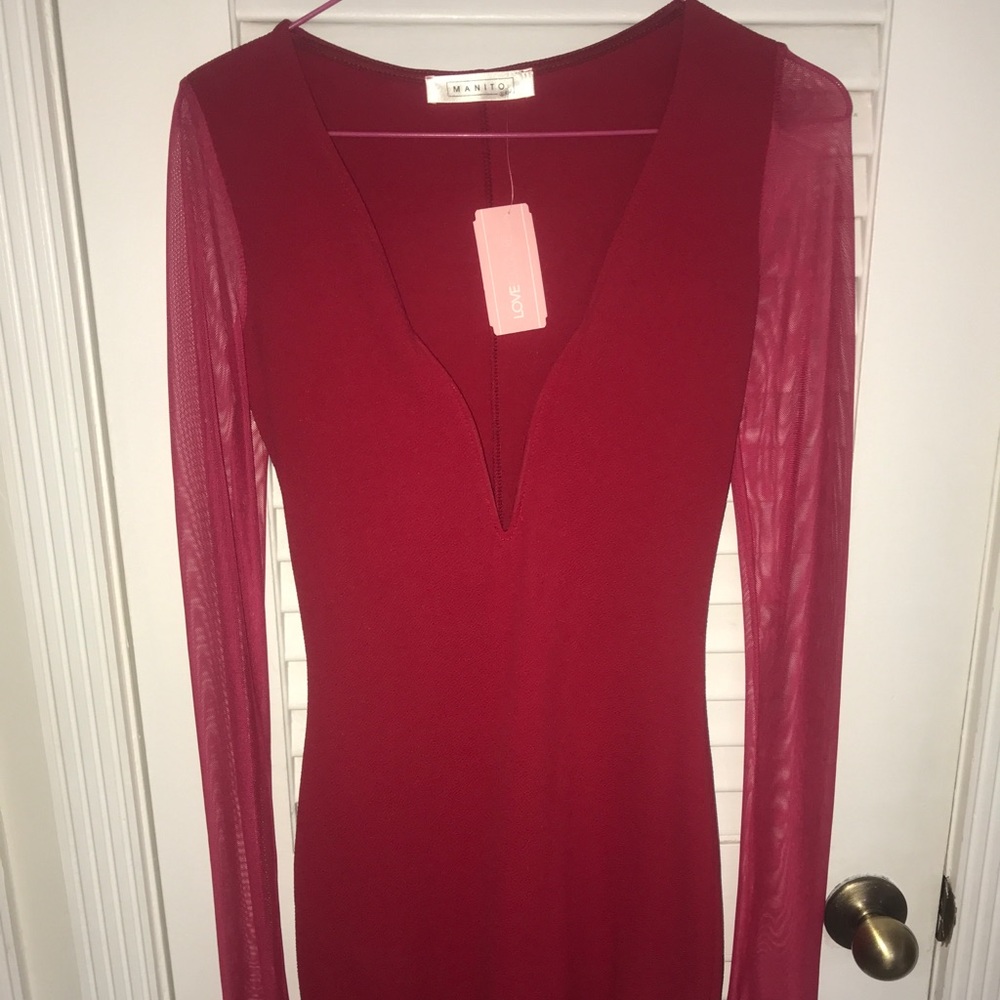 Sexy low cut red dress with sheer red sleeves.